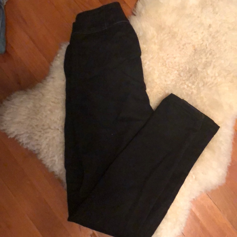 Black denim skinnies with gold zip front